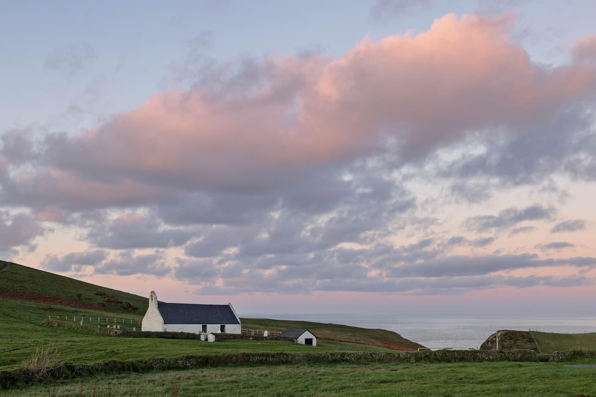 Pink clouds above the church at Mwnt